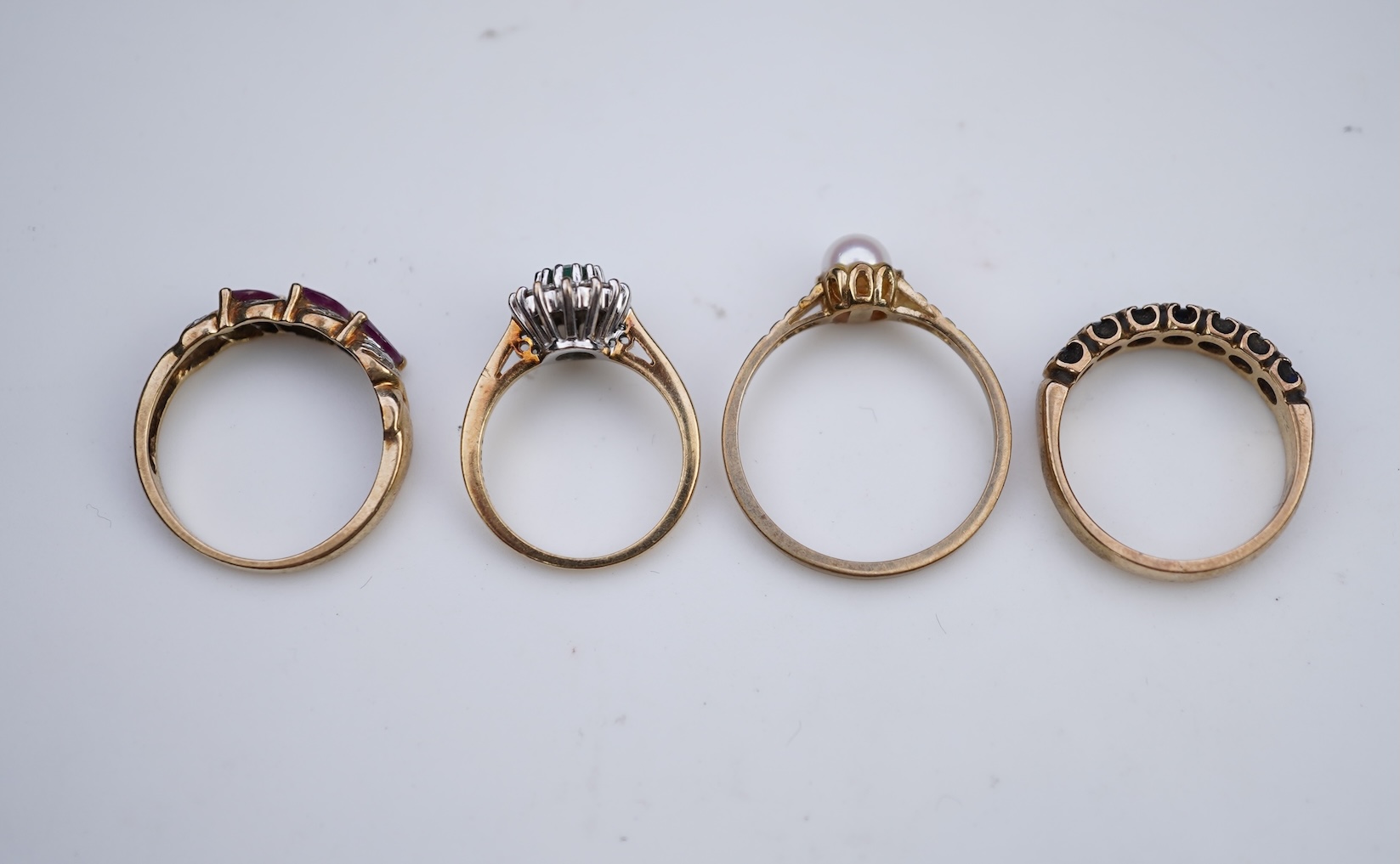 Four gem-set rings